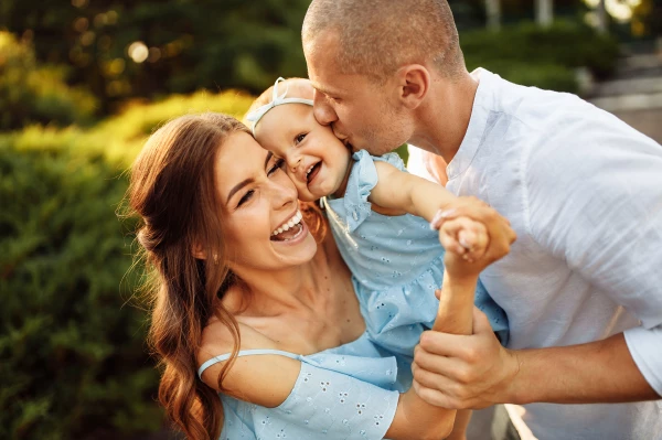 young family with baby in the middle